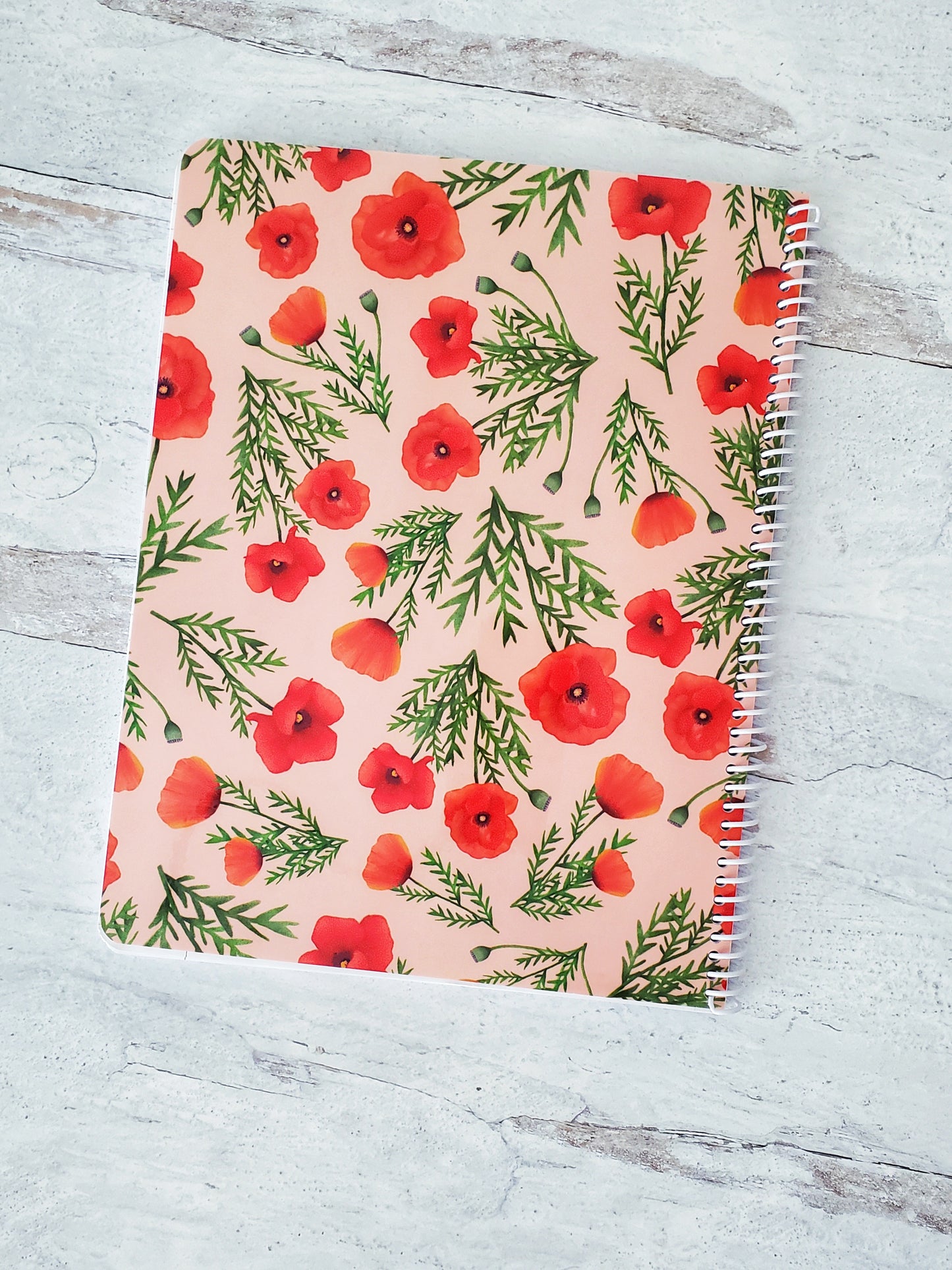 back cover of light pink spiral notebook with red poppies floral pattern