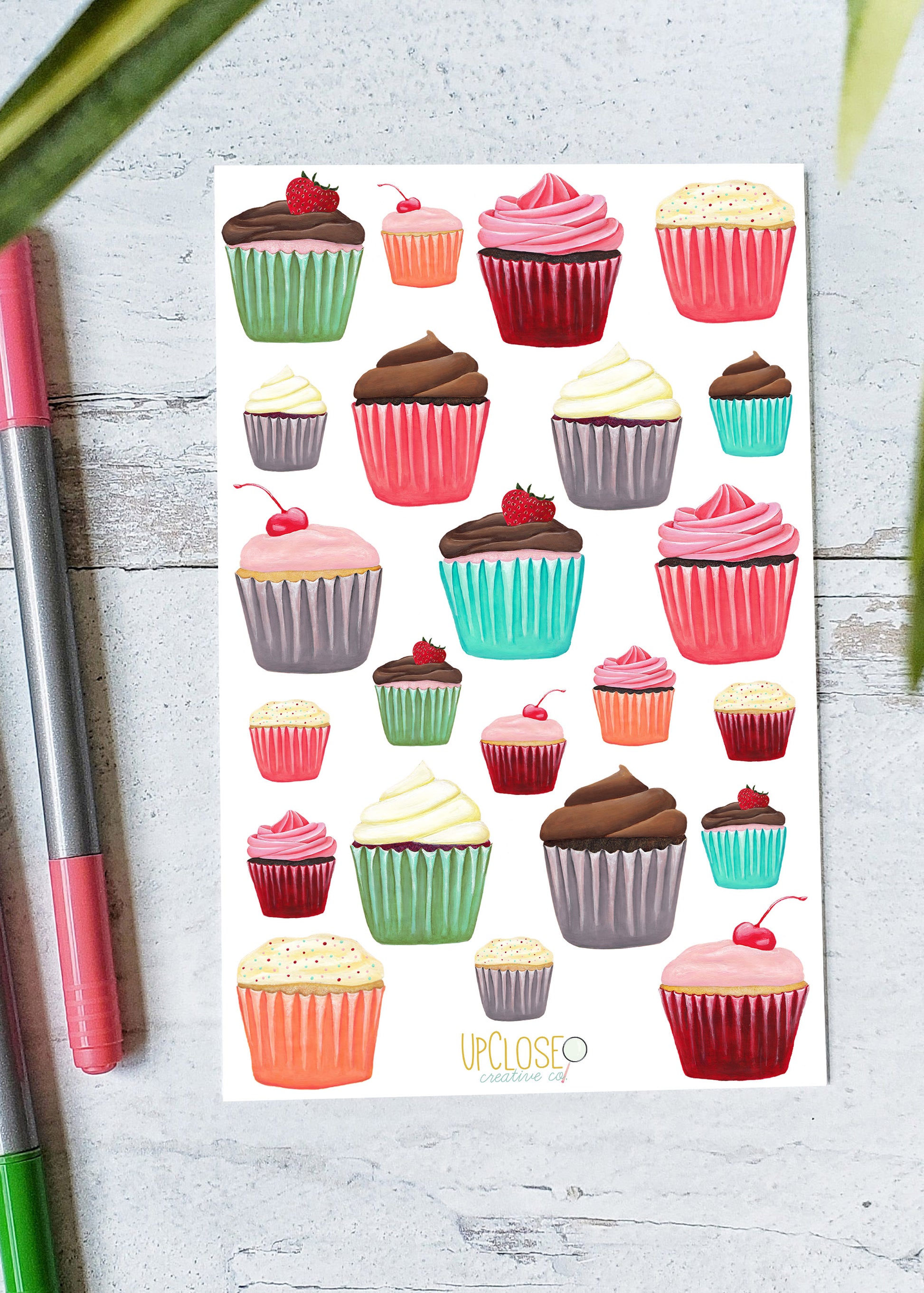 Sticker sheet featuring a variety of colorful frosted cupcakes.