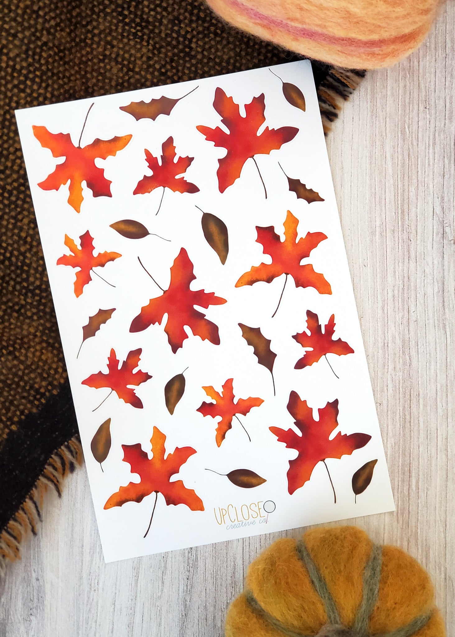 sticker sheet of illustrated fall leaves maple leaves are a mixture of red orange and yellow