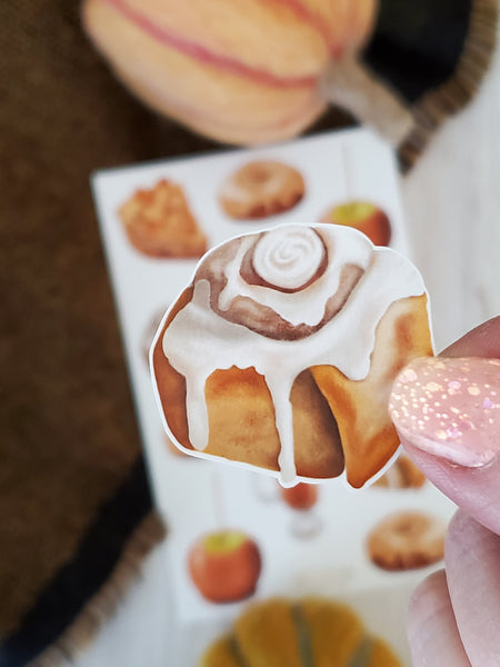 close up of illustrated cinnamon roll sticker