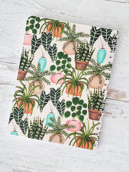 back cover of notebook with illustrated house plants pattern