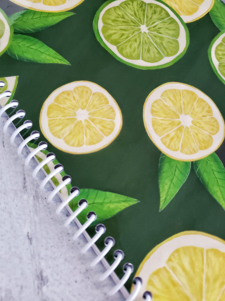 close up of lemon and lime artwork on notebook cover