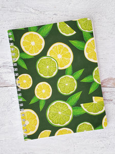 wire bound dark green notebook with illustrated lemon and lime slices pattern 