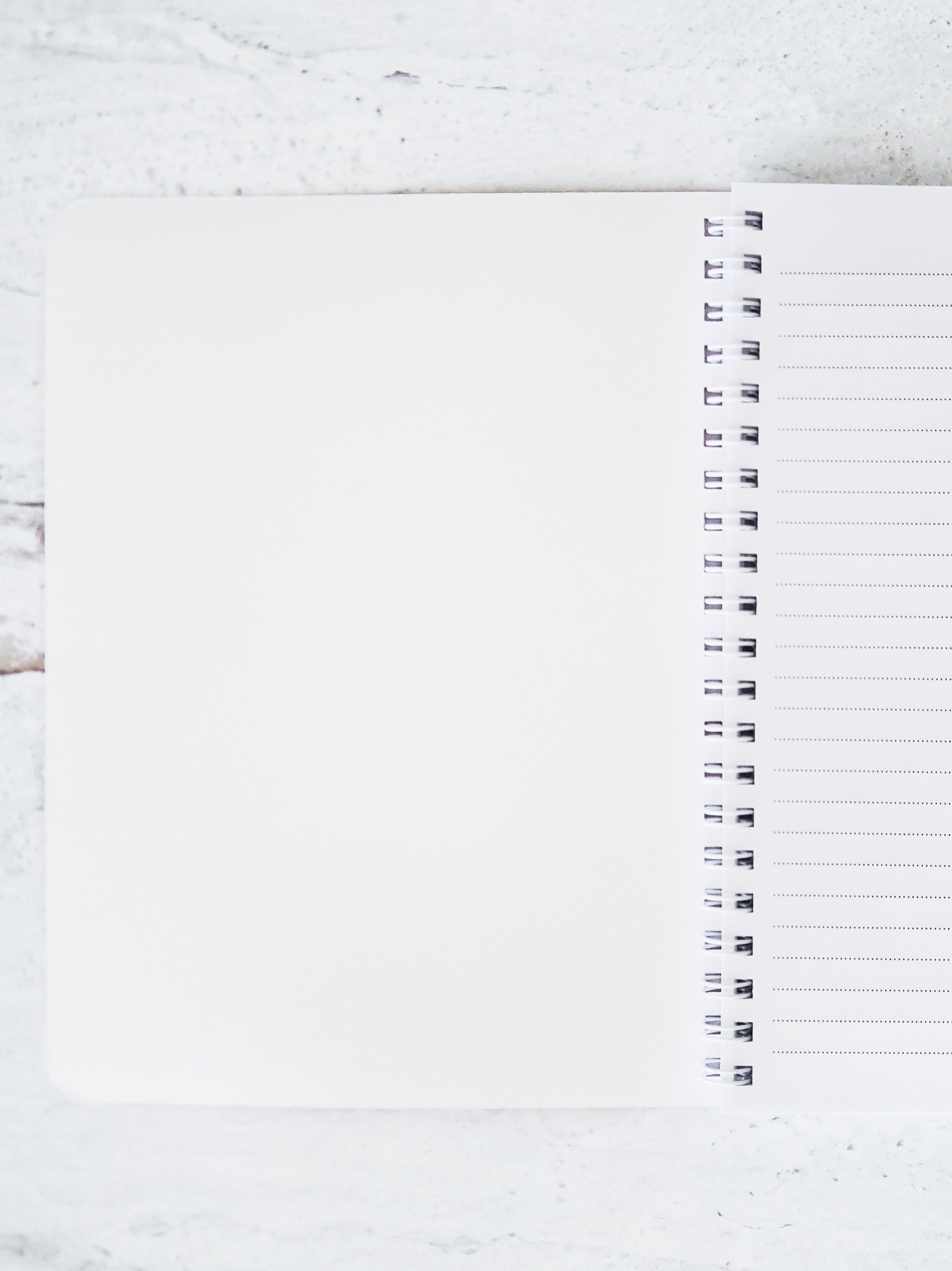 notebook flipped open to show inside front cover is blank