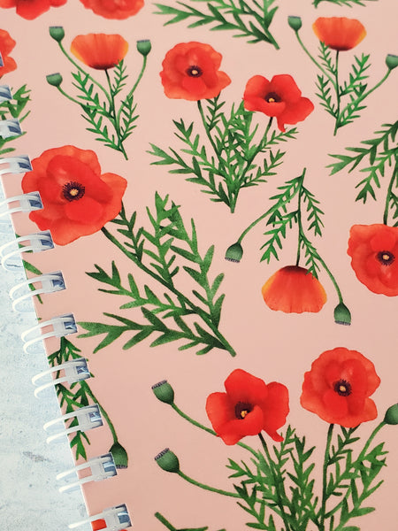 close up of notebook cover to show detail of poppy illustrations