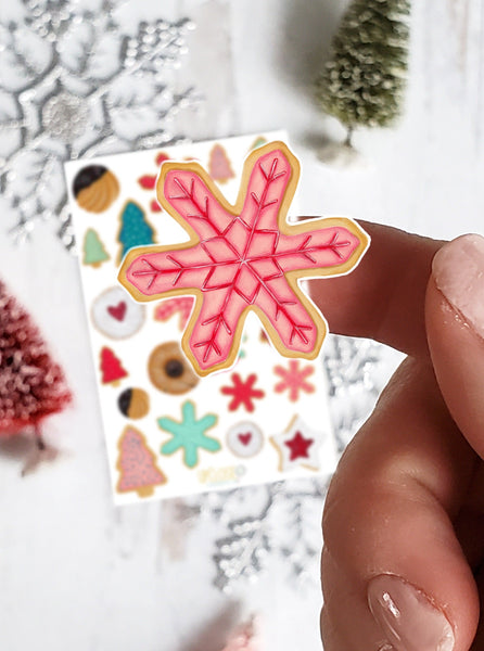 close up of pink and red snowflake sugar cookie sticker