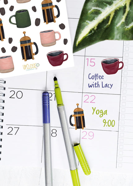 coffee stickers decorating a planner page