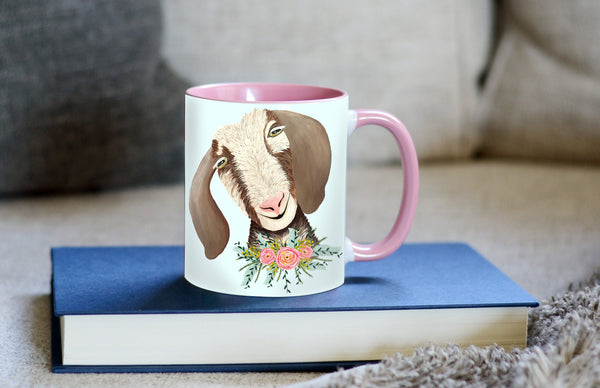 flower goat mug sitting on a book with comfy couch in the background