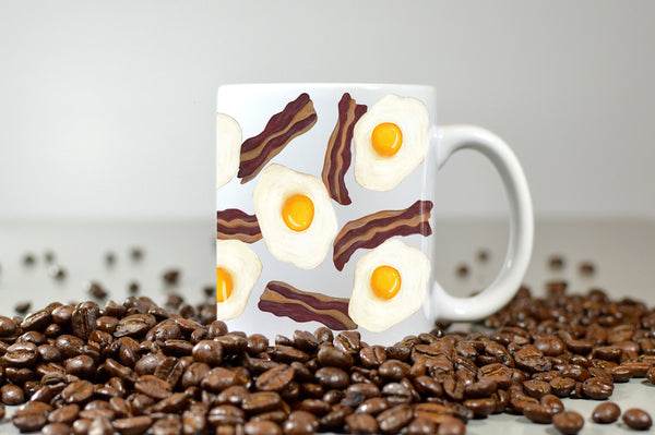 bacon and eggs mug surrounded by coffee beans