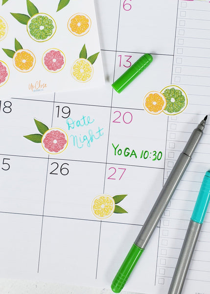 citrus fruit stickers on a calendar 