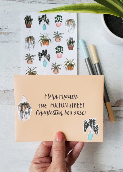 house plant stickers on a peach mailing envelope