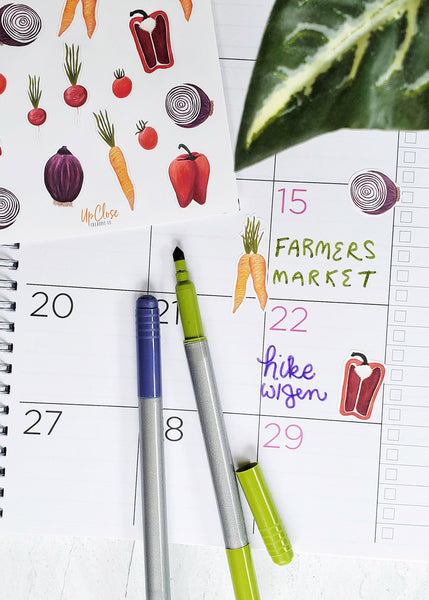 vegetable stickers on a calendar