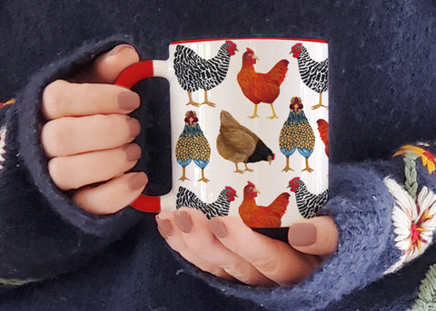ceramic mug with red handle and interior  pattern is hand painted chicken illustrations on white background